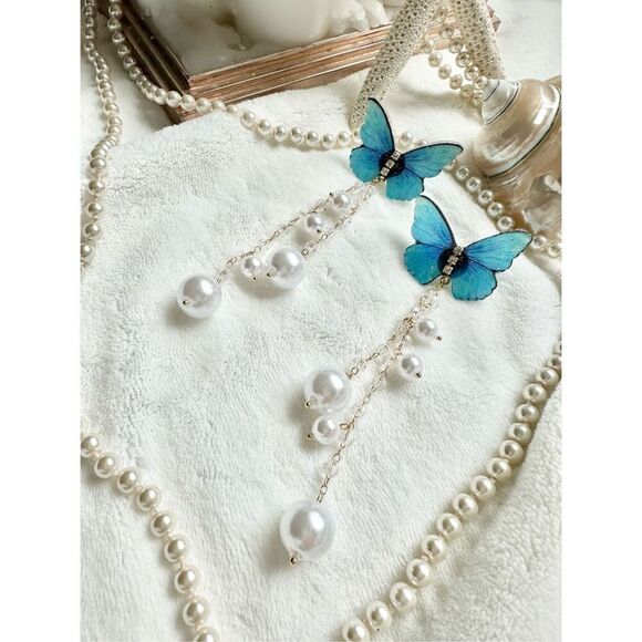 Bright blue butterfly earrings with faux pearl dangle ￼ - Picture 3 of 5